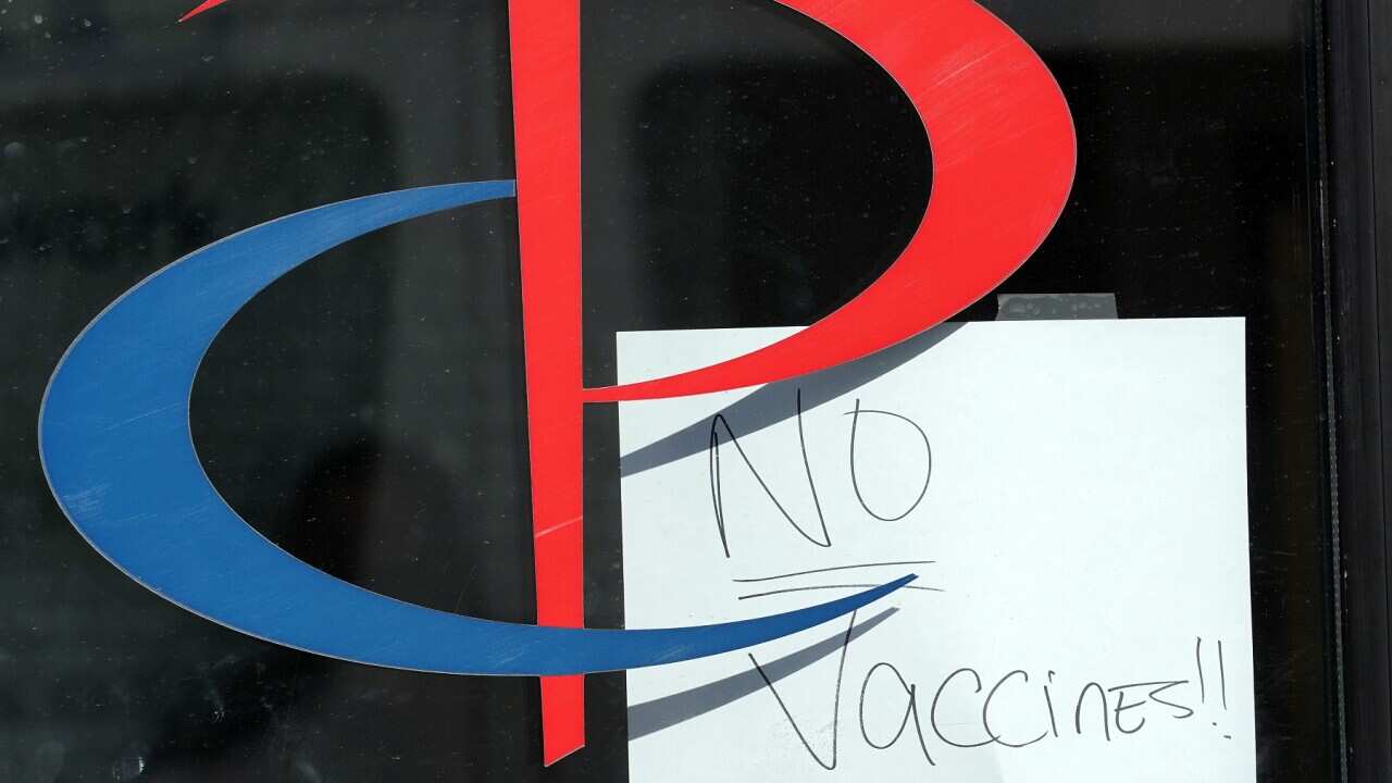 A sign on the entrance to a Brooklyn health care facility