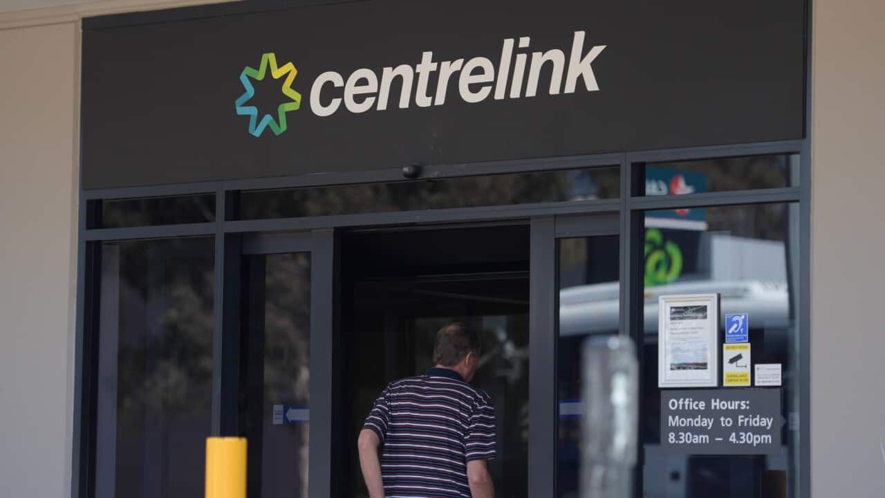 A man walking into a Centrelink office