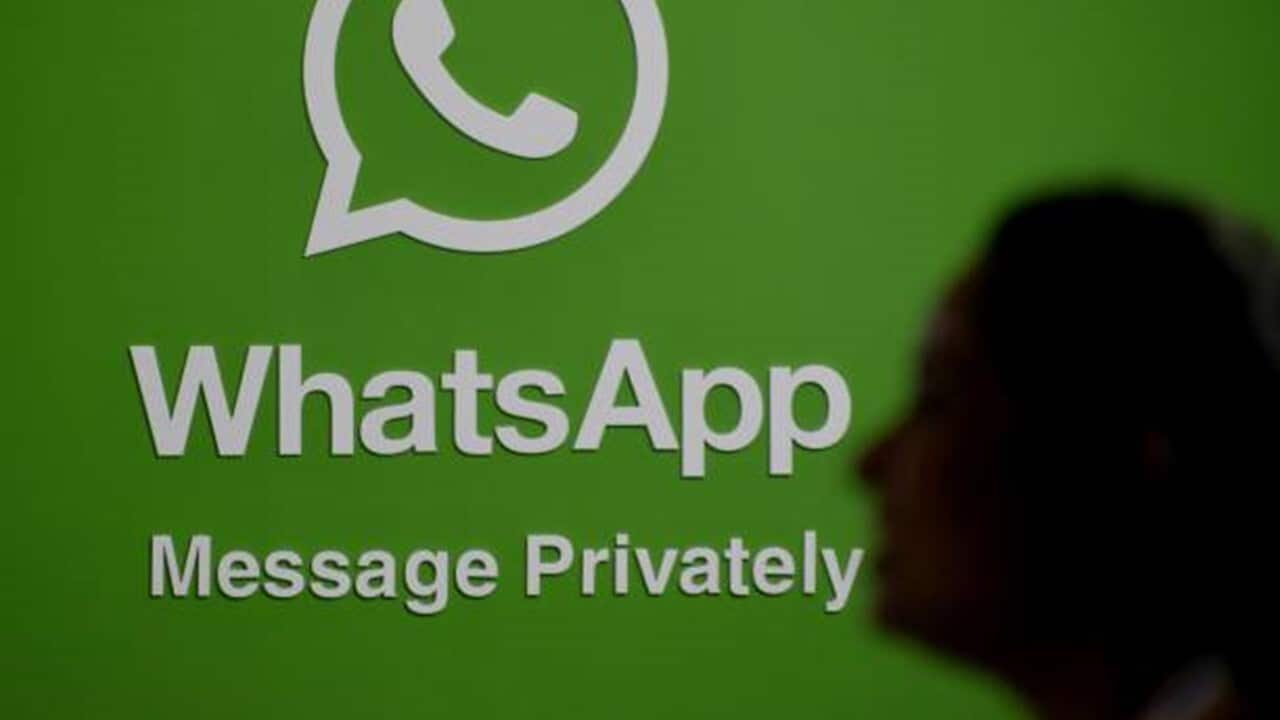 A silhouette of a woman is seen in front of a WhatsApp logo during Global Fintech Fest In Mumbai, India, 22 September, 2022.jpg