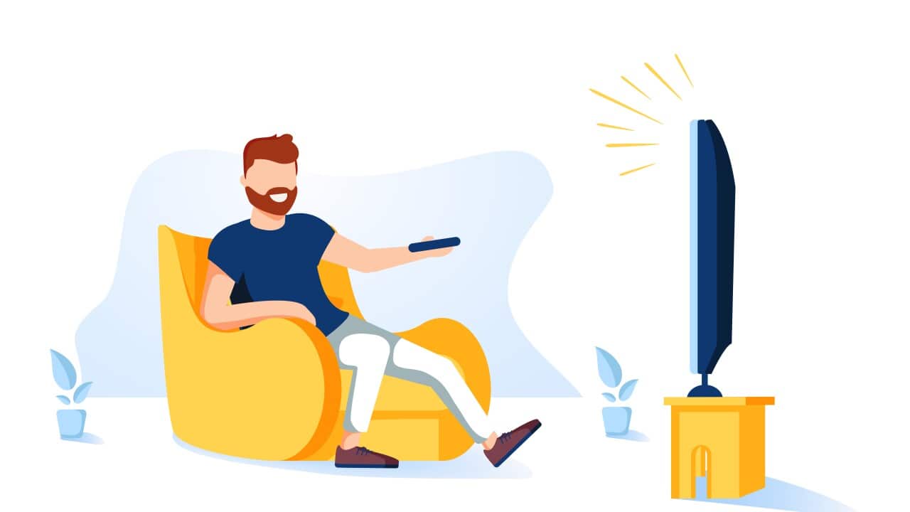 Man sitting on the couch and watching TV