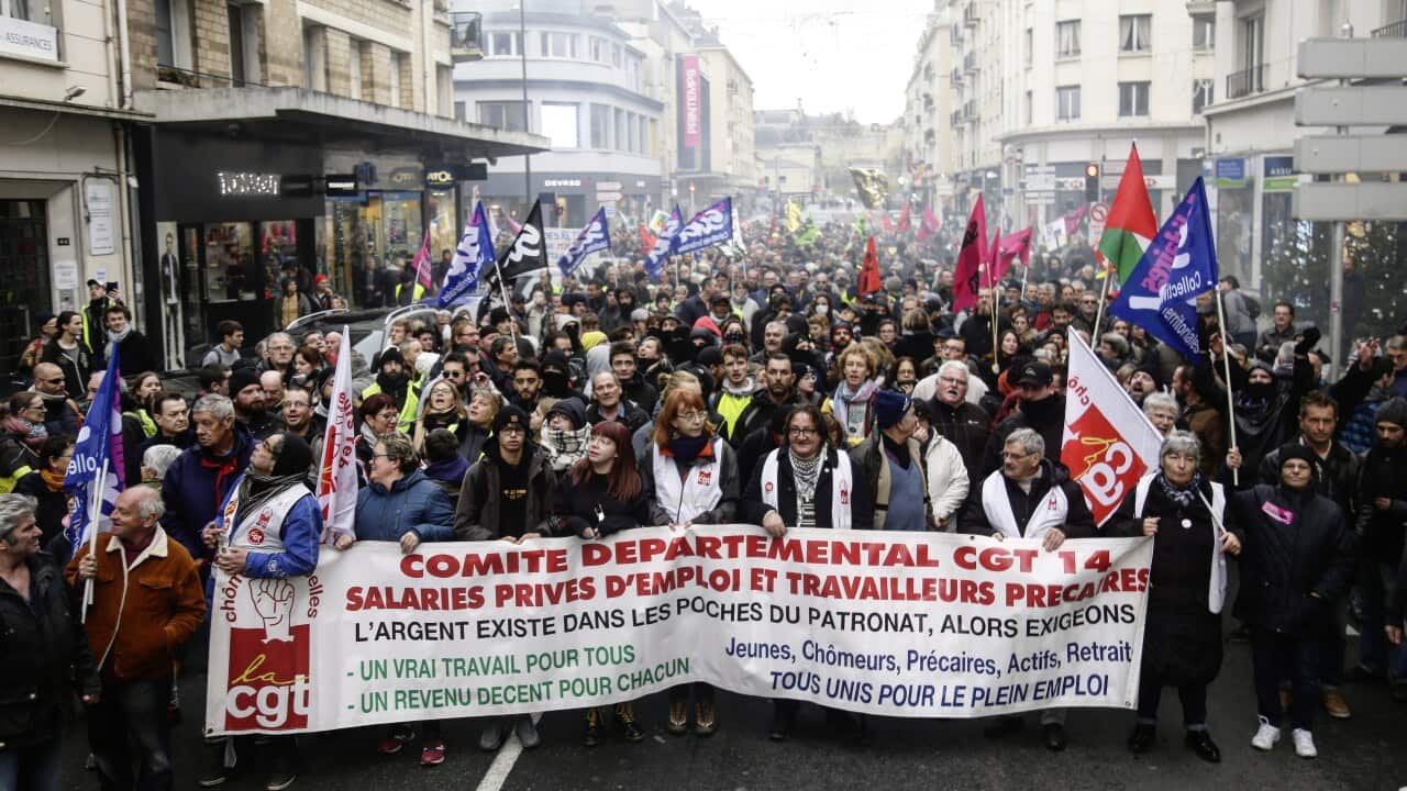 Crowds take part in a demonstration against the pension overhauls, in Caen, France.