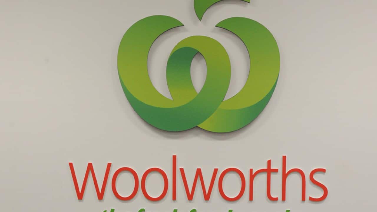 A Woolworths logo outside a supermarket