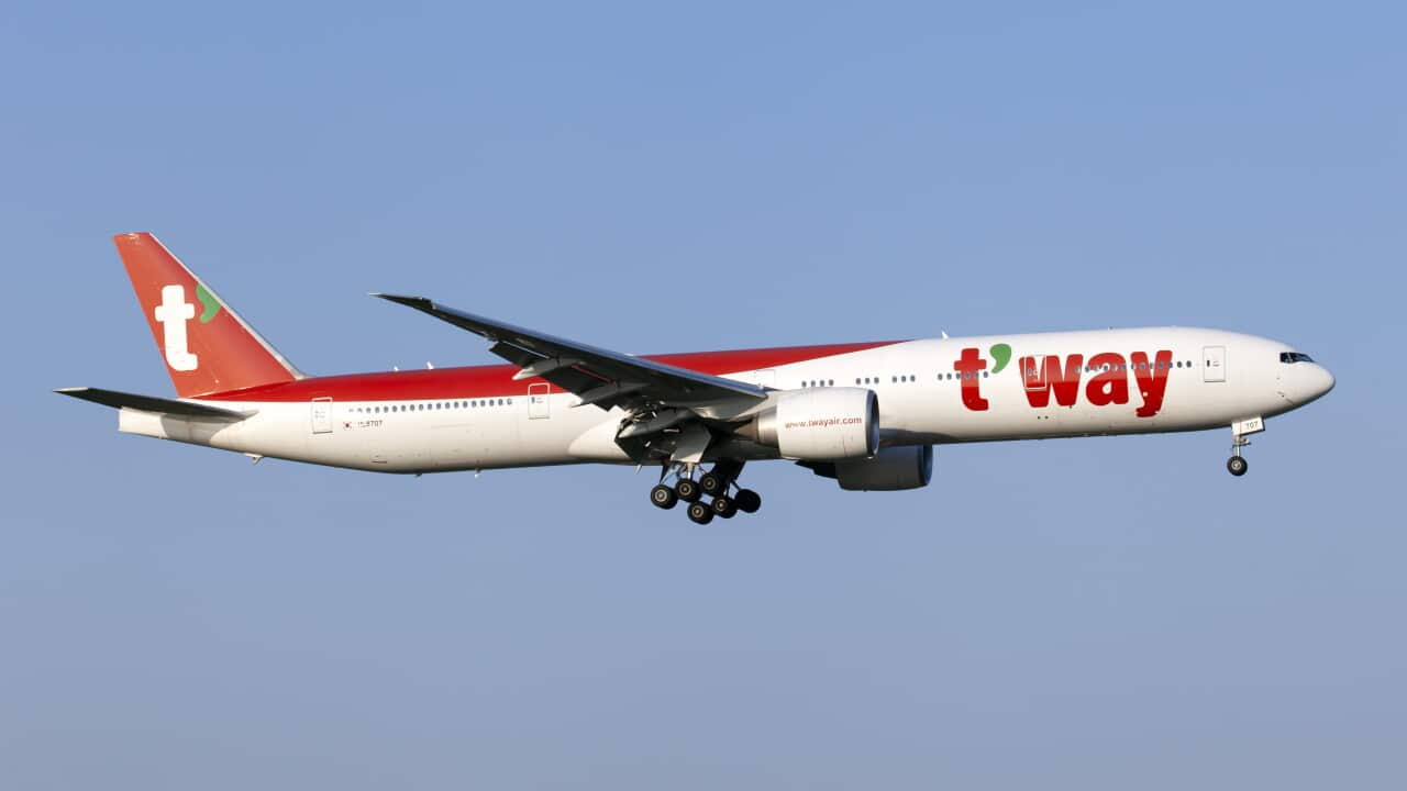 A T'Way Air Boeing 777-300ER landing at Rome Leonardo da