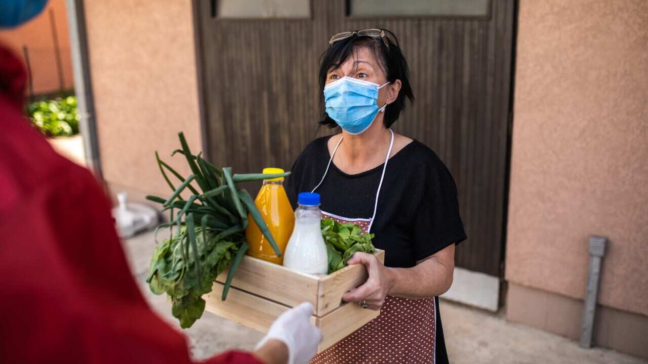 helping covid woman face mask