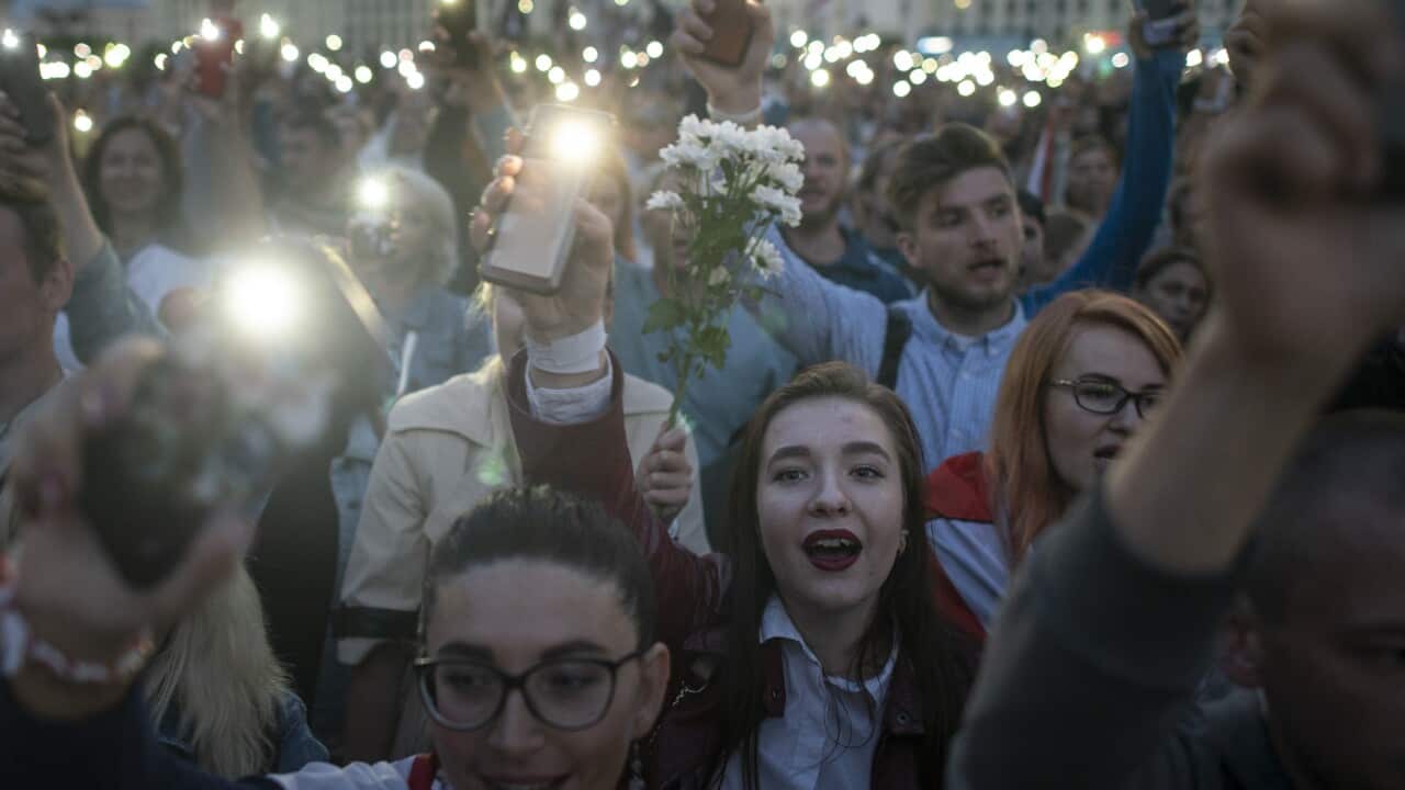 Belarusian opposition supporters light phones lights during a protest rally in front of the government building in Independence Square in Minsk, Belarus.