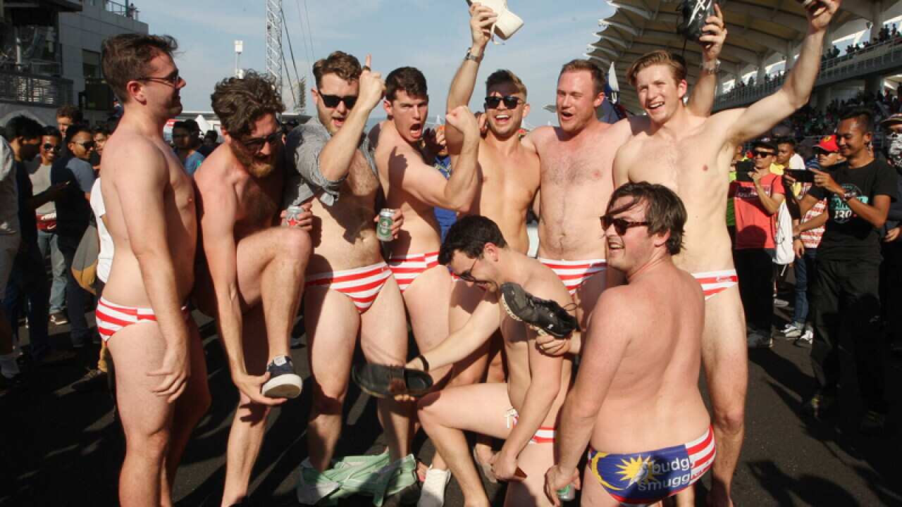 Australian men celebrate in Budgy Smuggler-brand swimsuits