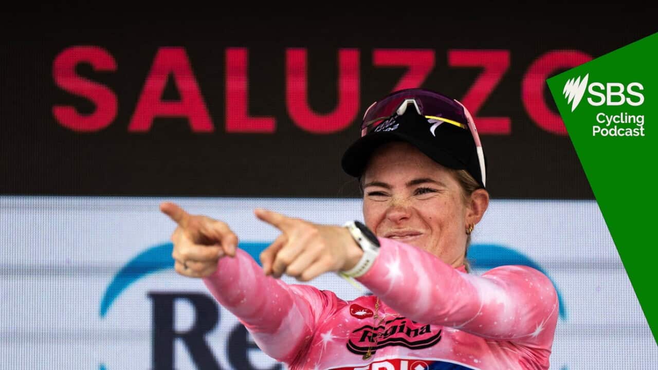 FDJ SUEZ Dutch rider Demi Vollering wearing the overall leader's pink jersey holds the trophy as she celebrates on the podium after winning the Giro d'Italia Women 2026 - Tour of Italy Women cycling race in Saluzzo, Northwestern Italy, on June 7, 2026. (Photo by MARCO BERTORELLO / AFP)