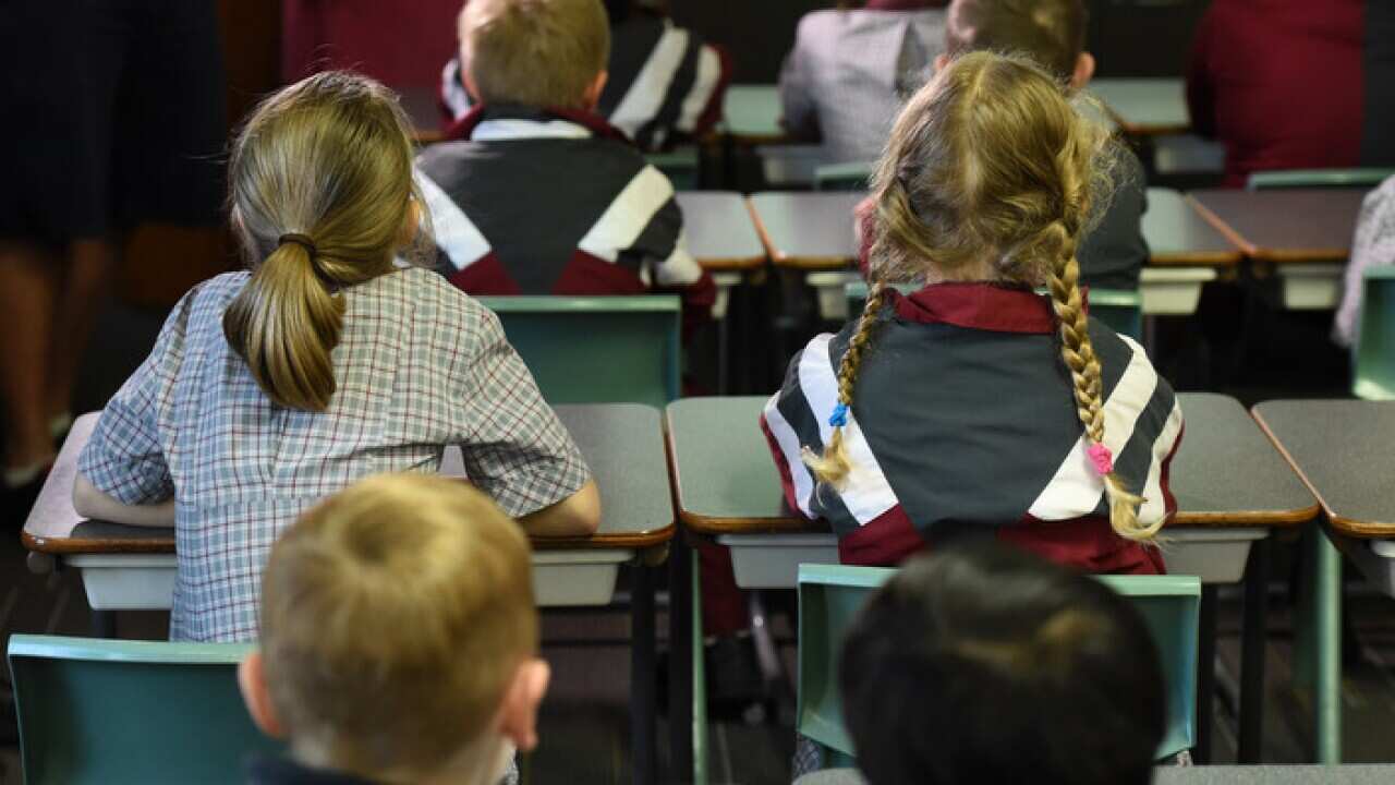 Children sit in a classroom during a lesson at Stafford State School in Brisbane
