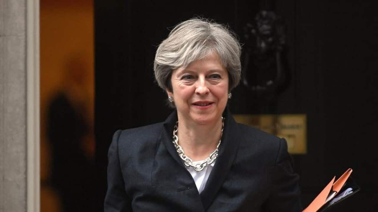 Theresa May seen leaving Brexit meeting.