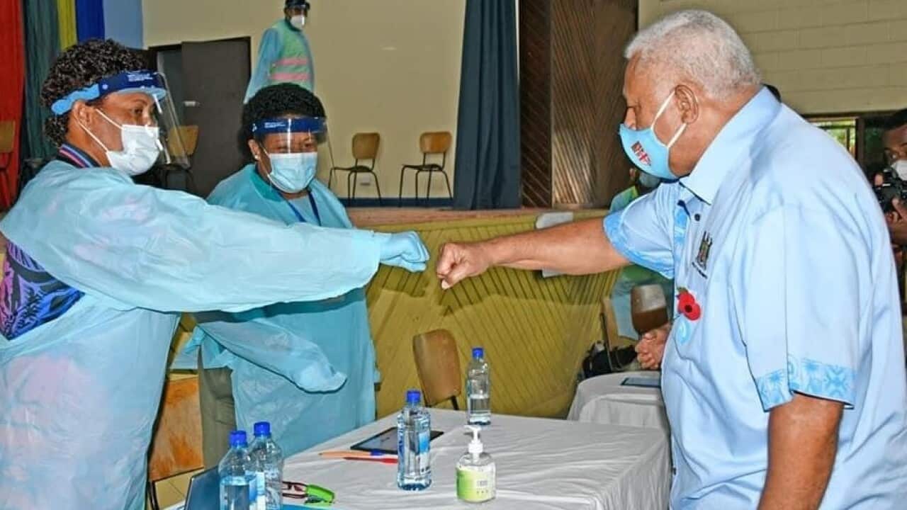 Fiji Prime Minister Frank Bainimarama meets health workers at one of the vaccination command centres in Viti Levu.