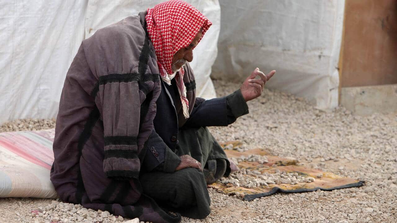 Image A Syrian man outside his tent at a refugee camp in Lebanon (AAP).jpg
