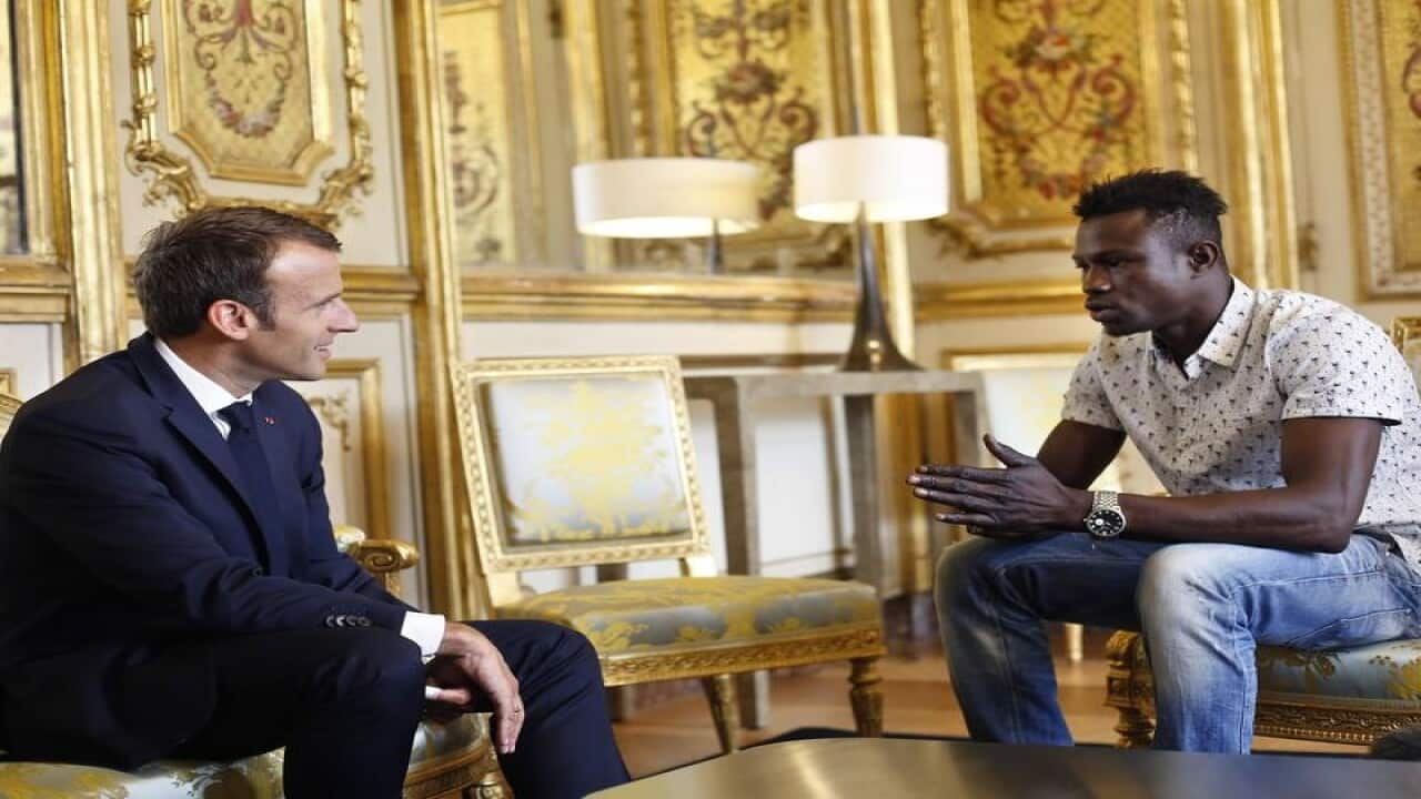 French President Emmanuel Macron meets with Mamoudou Gassama