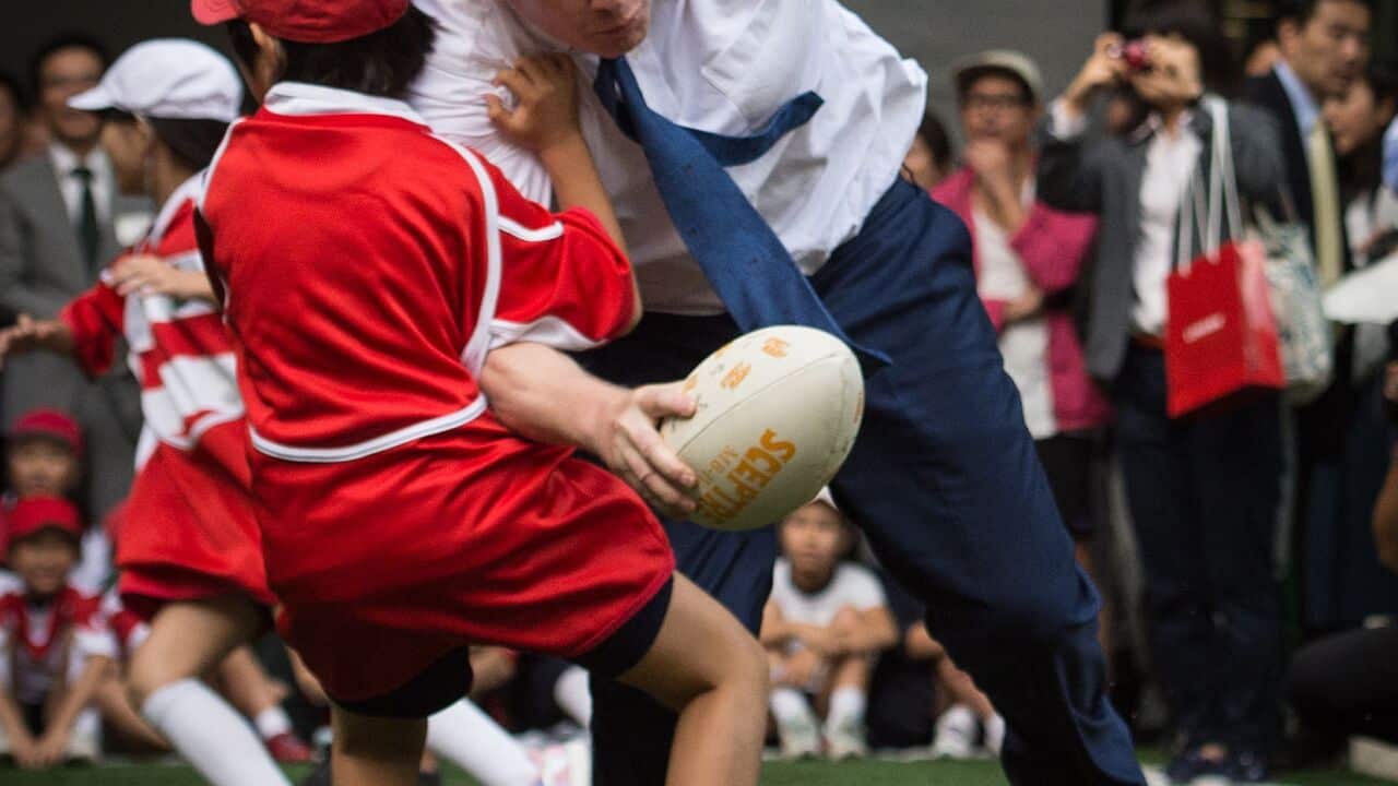 Mayor of London Boris Johnson knocks over 10-year-old Toki Sekiguchi.