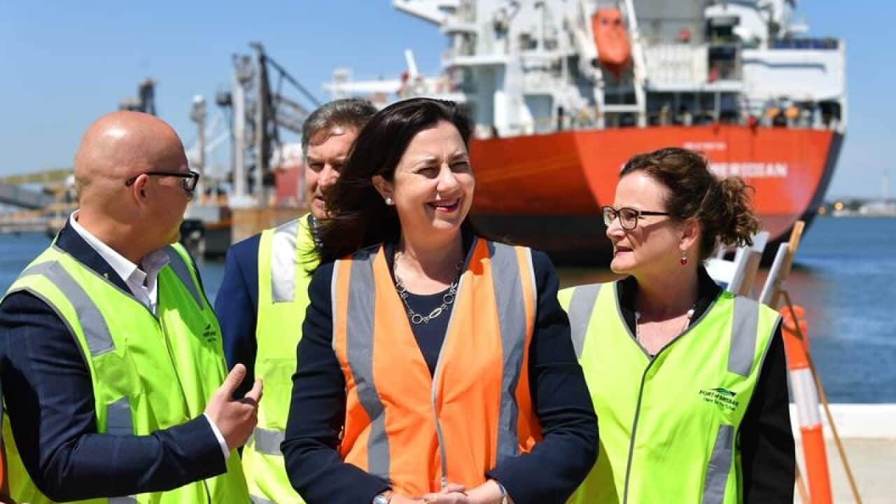 Queensland Premier Annastacia Palaszczuk (C) during an announcement