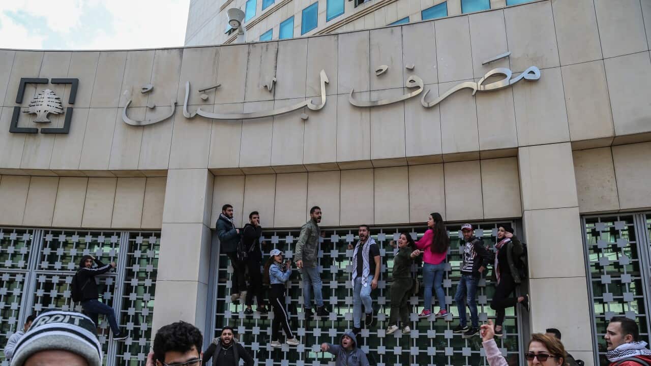 Anti-government protester during calling for 'the fall of the rule of the bank' during a protest in front of the Lebanese Central Bank headquarters