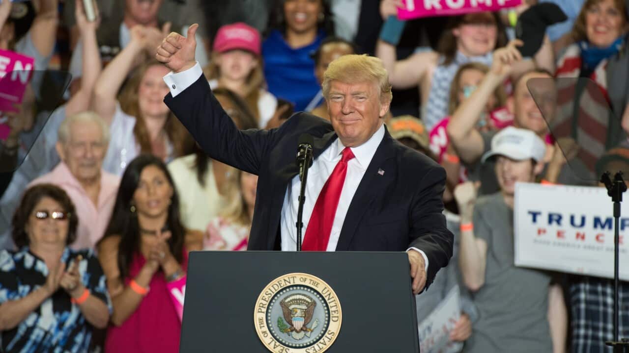 President Donald J. Trump gives the thumbs up during a rally at the Pennsylvania Farm Show Complex in Harrisburg, Pennsylvania.