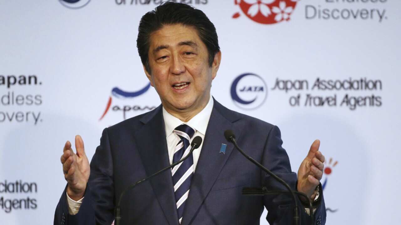 Japanese Prime Minister Shinzo Abe delivers the keynote speech