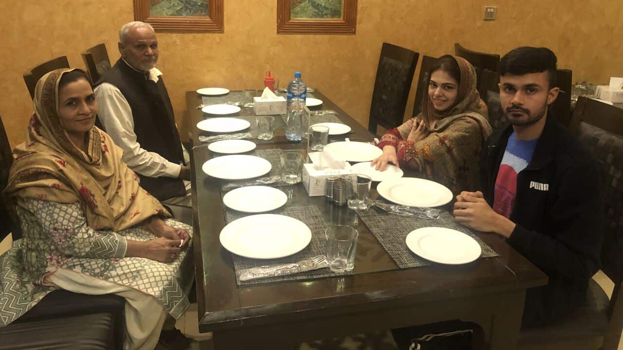 Haroon Iqbal (right) with his mother and father (left)