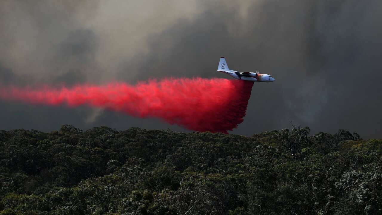 An air tanker drops fire retardant on the Gospers Mountain fire near Colo Heights south west of Sydney.