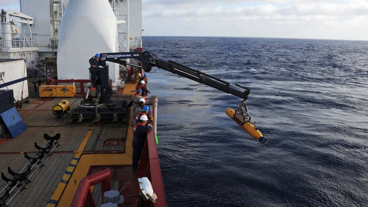 Crew on Australian vessel Ocean Shield lower the Bluefin-21 into the Indian Ocean - Getty-1.jpg