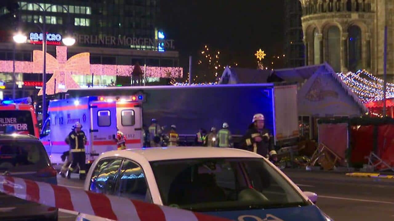In this screen grab taken from video, emergency services attend the scene, after an attack by a truck at a Christmas market, in Berlin (AP)