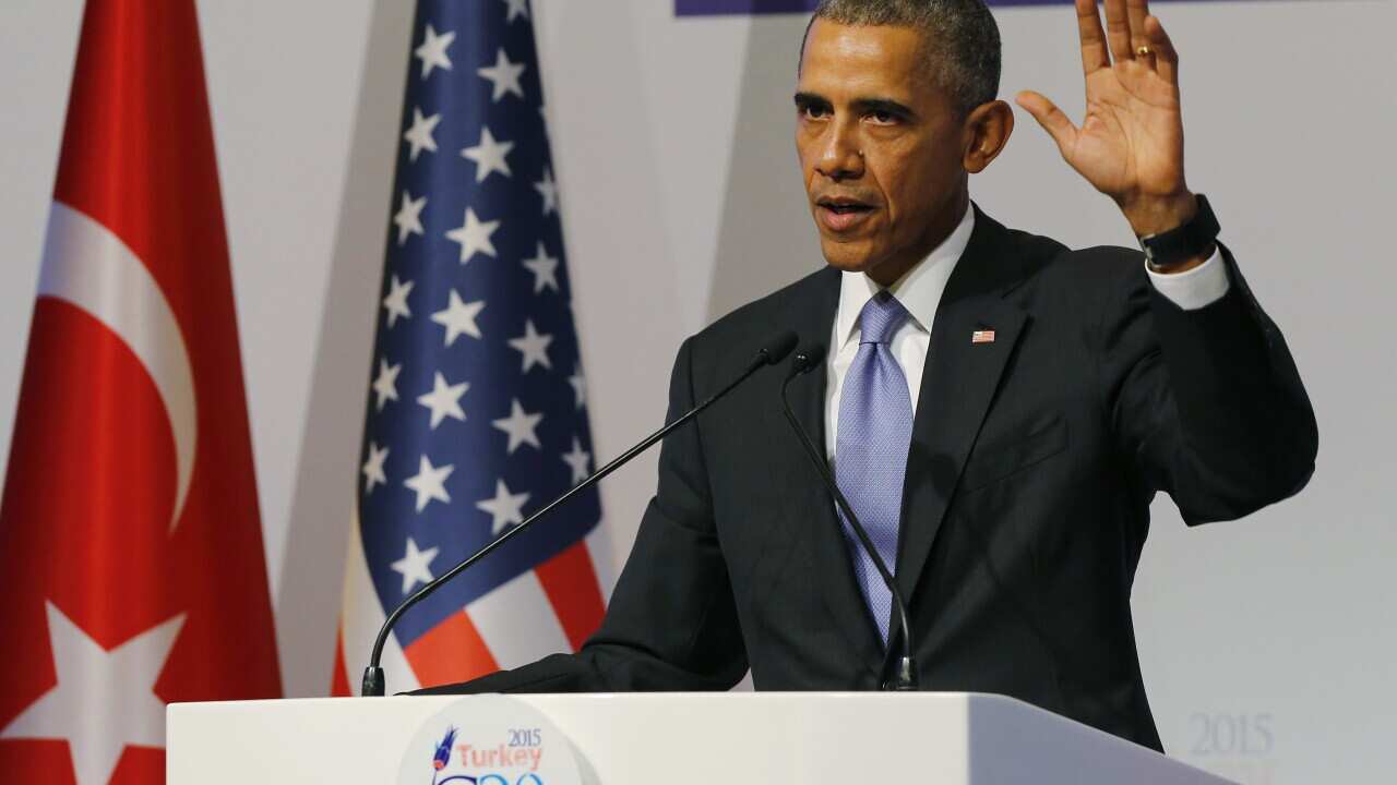 U.S. President Barack Obama gestures to journalists following a news conference at the end of the G-20 summit in Antalya, Turkey, Monday, Nov. 16, 2015. (Anadolu Agency via AP, Pool)