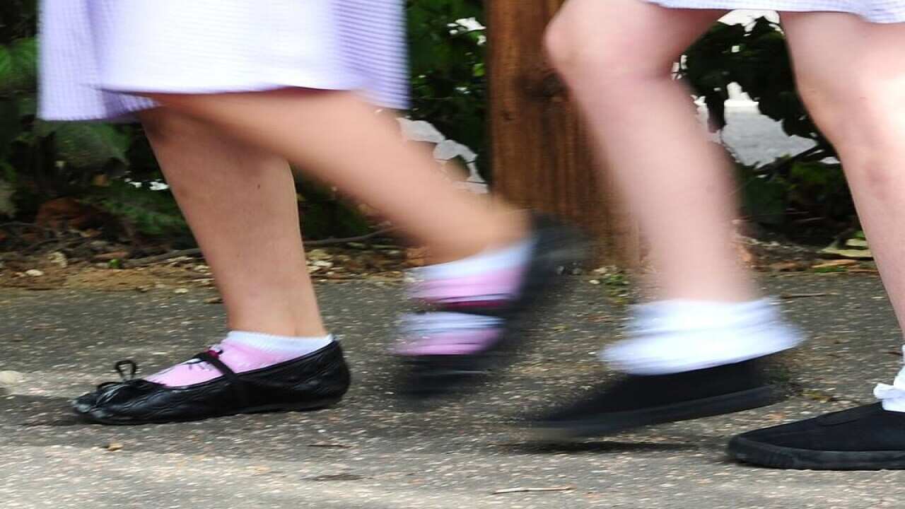 School girls walking to school