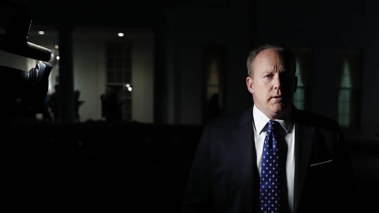White House press secretary Sean Spicer walks from the West Wing of White House, in Washington, Tuesday, May 9, 2017, to speak to reporters.