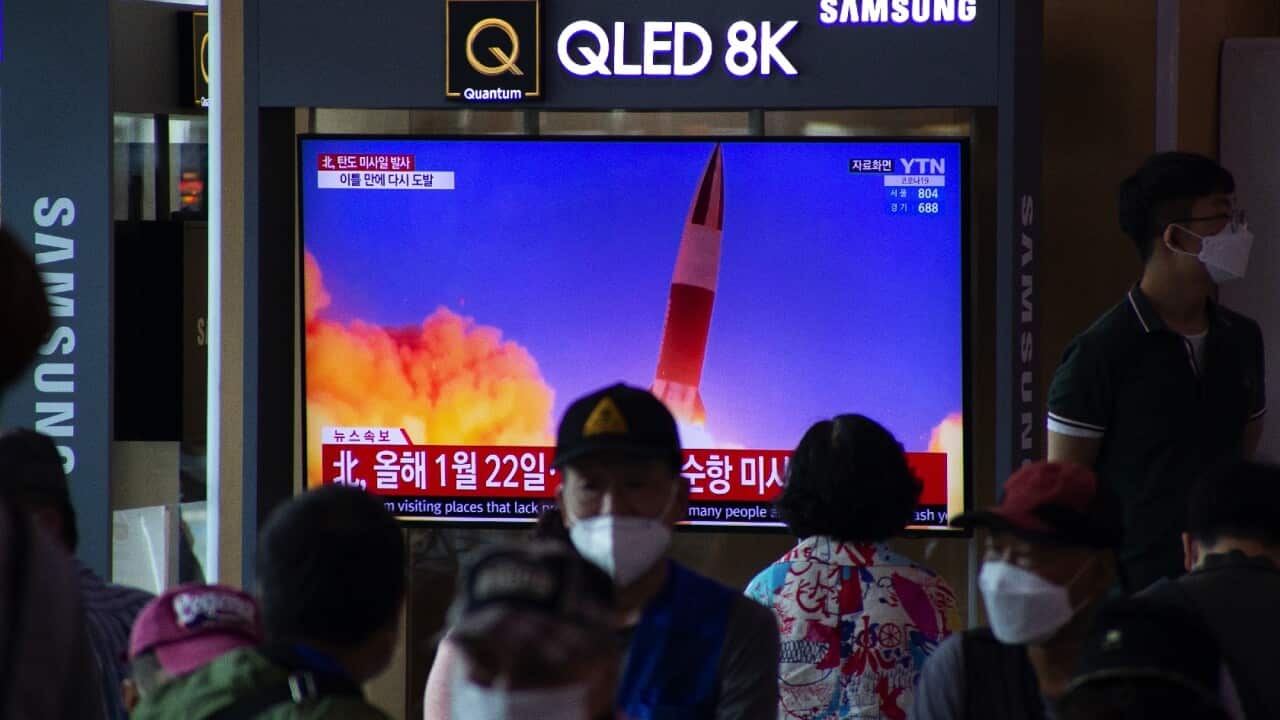 People at a train station in Seoul watch a breaking news report in Seoul, South Korea on 15 September 2021.