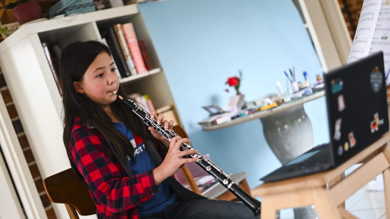 A student completes an online music lesson in Canberra