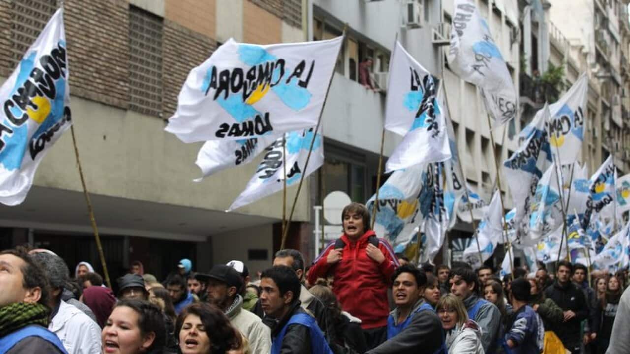Demonstrators participate in a protest in front of the National Congress, in Buenos Aires