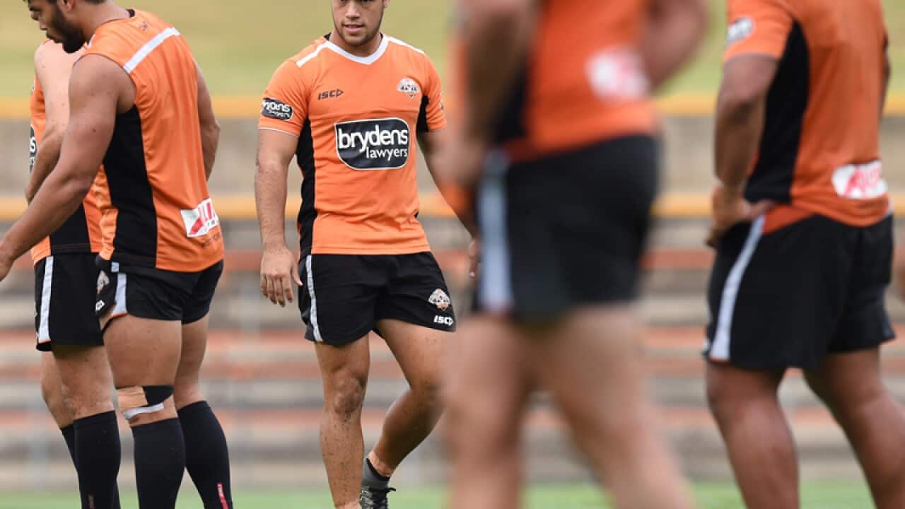 Wests Tigers player Luke Brooks (centre)