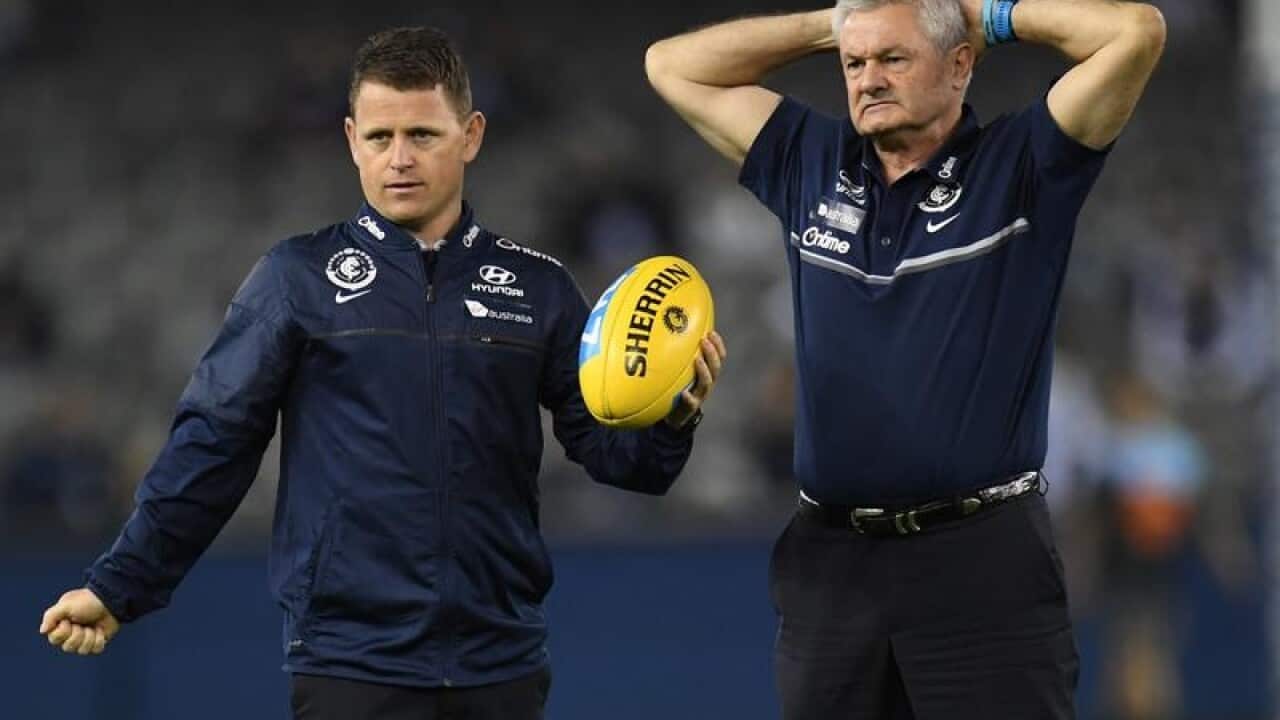 Brendon Bolton (left) and Neil Craig before the Round 12 AFL match.