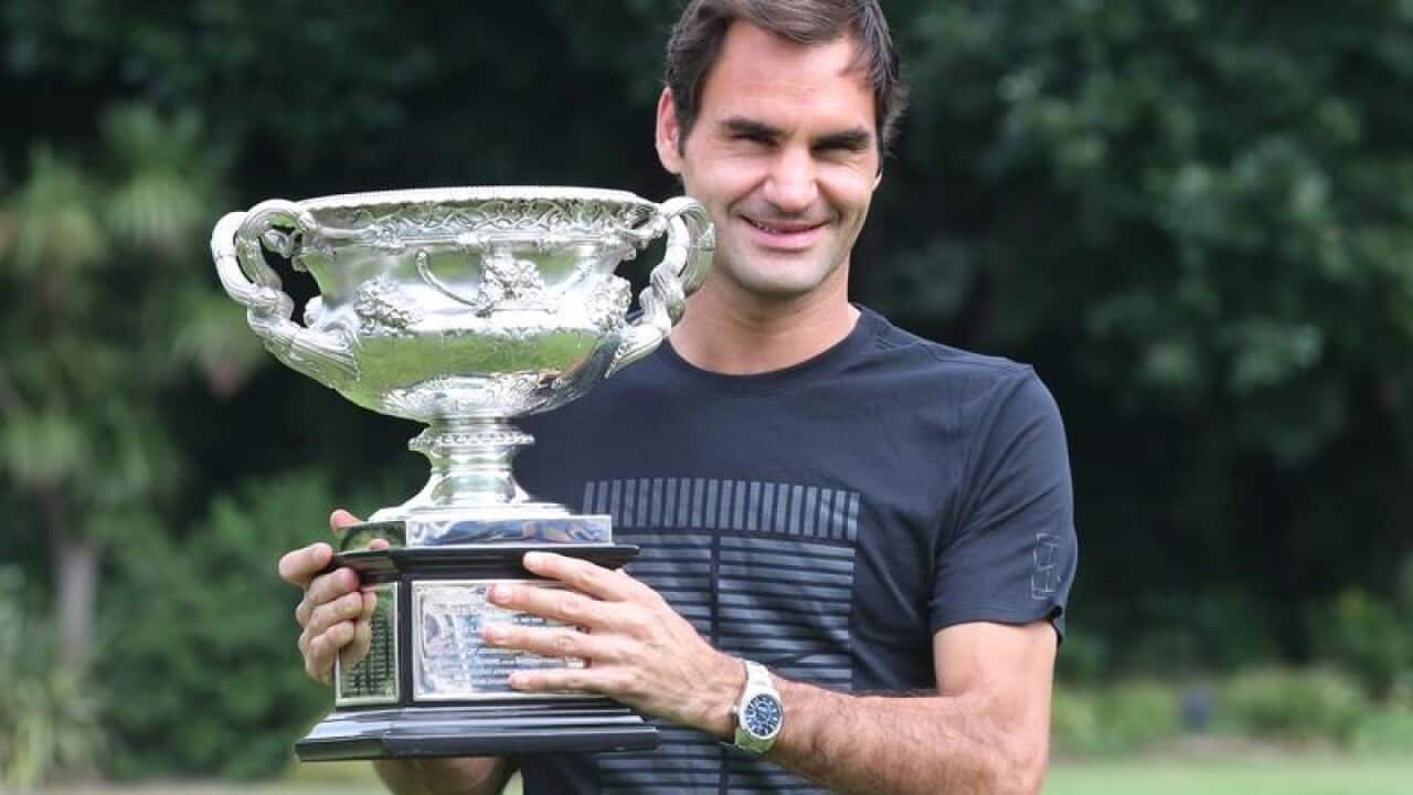 Roger Federer with the Australia Open trophy
