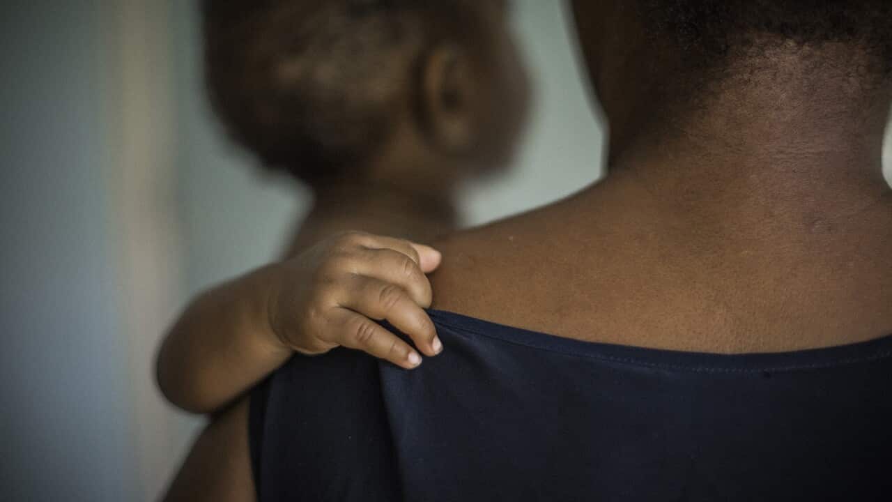 Woman and child experiencing domestic violence.