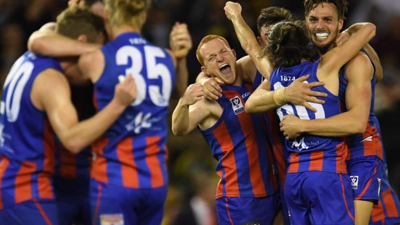 Port Melbourne Boroughs players celebrate winning the VFL Grand Final.