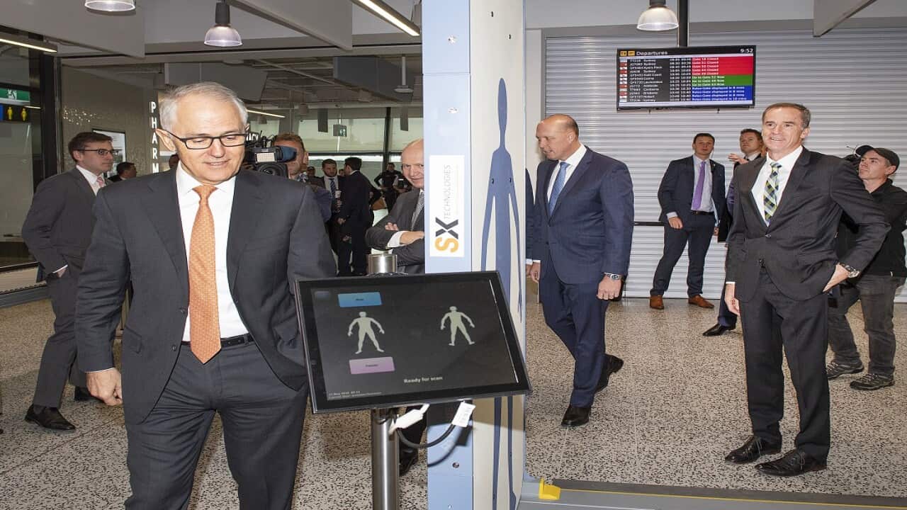 Australian Prime Minister Malcolm Turnbull and the Minister for Home Affairs Peter Dutton MP, are seen inspecting a body scanner during an airport security announcement, at Tullamarine Airport