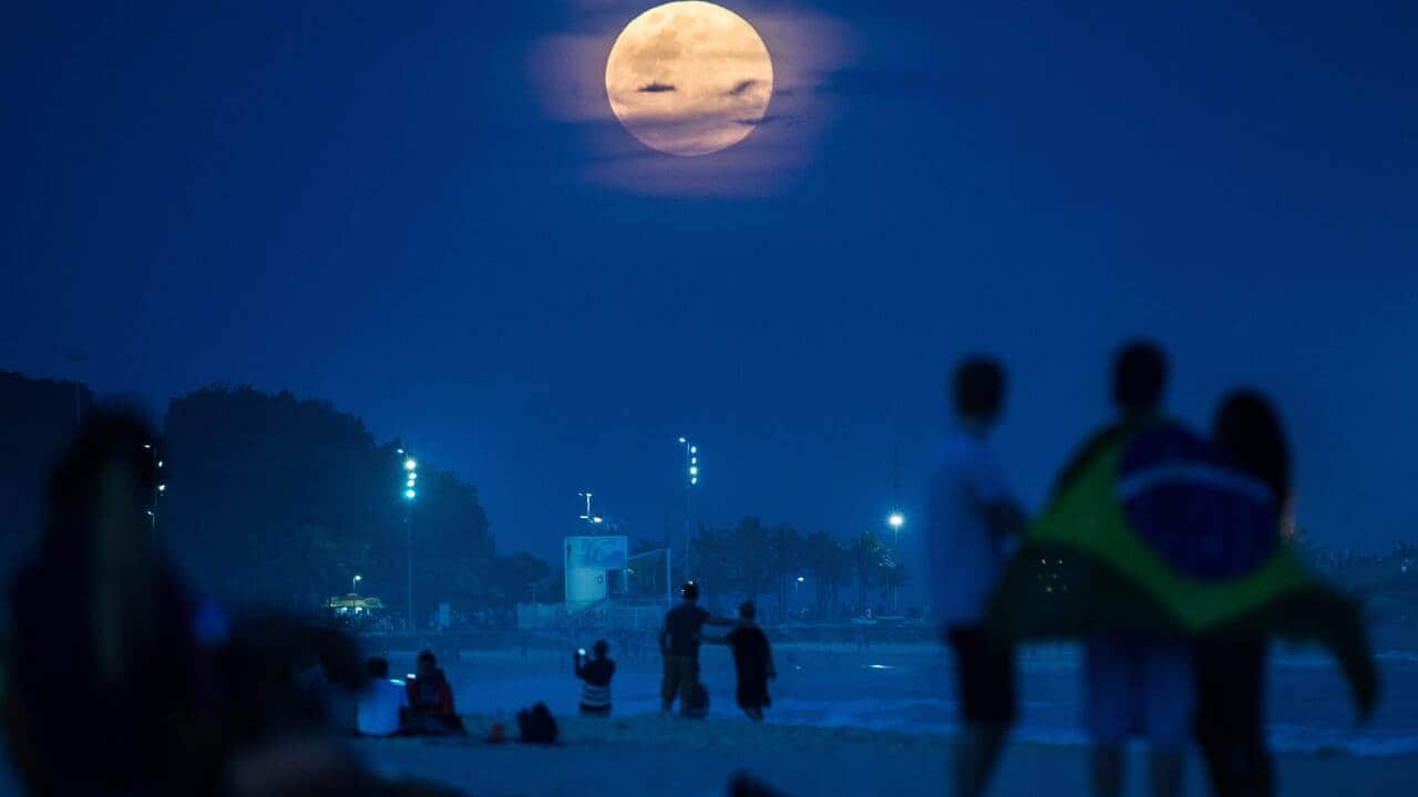 Supermoon rises at Ipanema beach in Rio de Janeiro, Brazil.