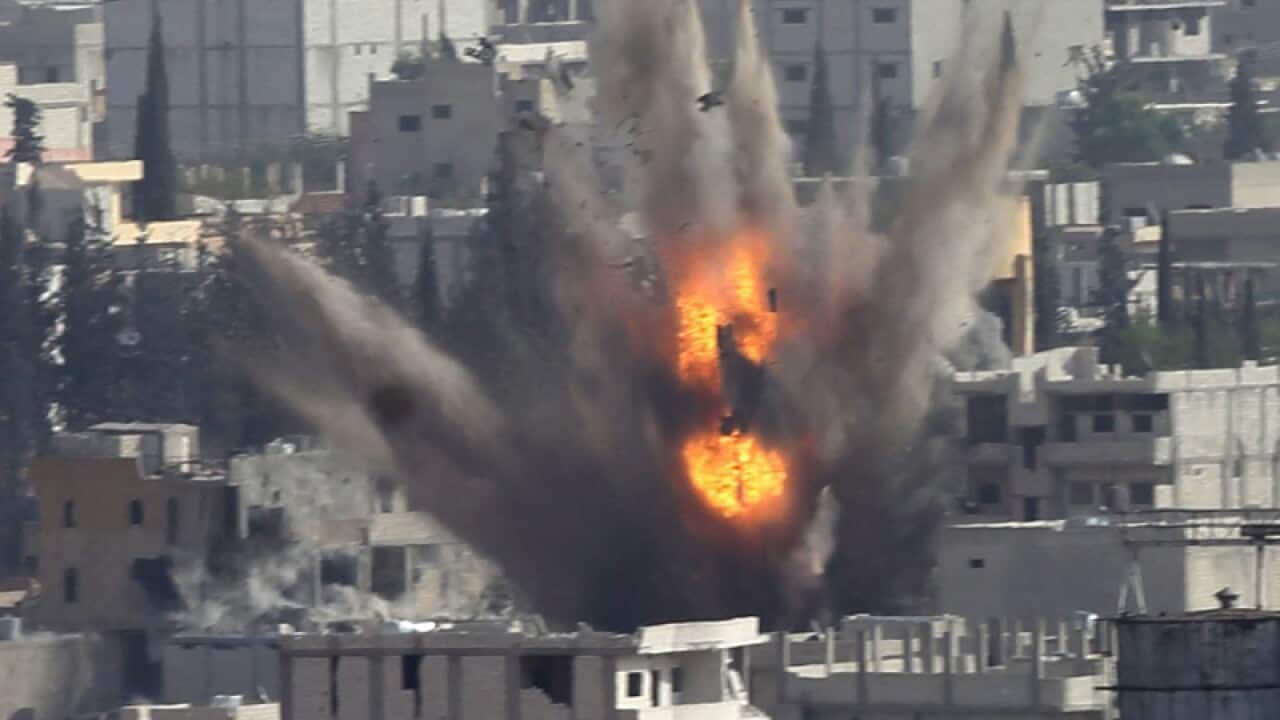 Smoke rise after US-led coalition airstrike on Kobane, Syria.