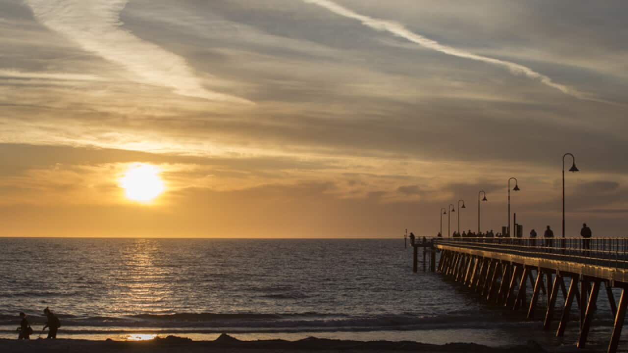 The sun sets over Glenelg Jetty.