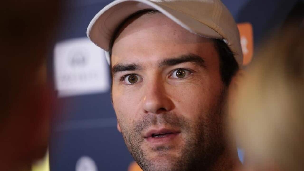 Demons player Jordan Lewis speaks to the media at a press conference.