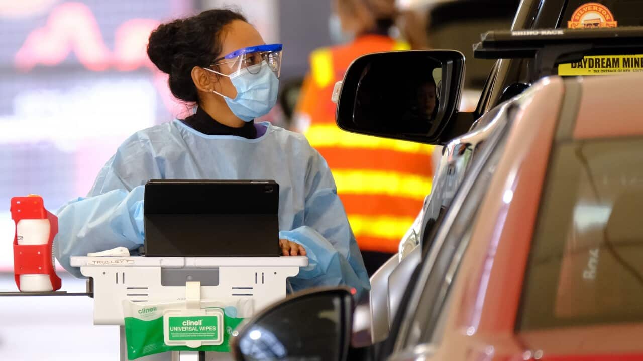 Health workers are seen testing people for Covid19 at Royal Melbourne Showgrounds