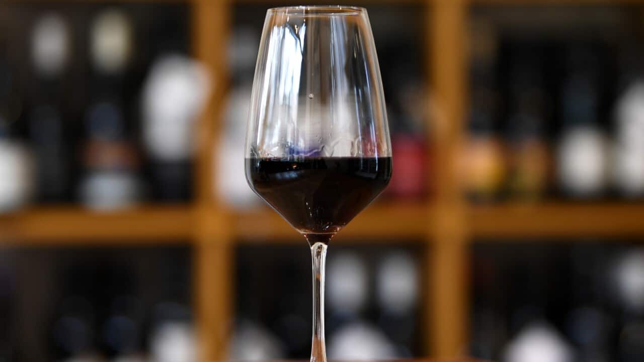 A wine glass filled with red wine at Pin Oak Beer & Wine bar in Melbourne, Wednesday, August 19, 2020. China has launched an investigation into whether Australian winemakers are flooding the country with cheap wine and drowning out local producers.