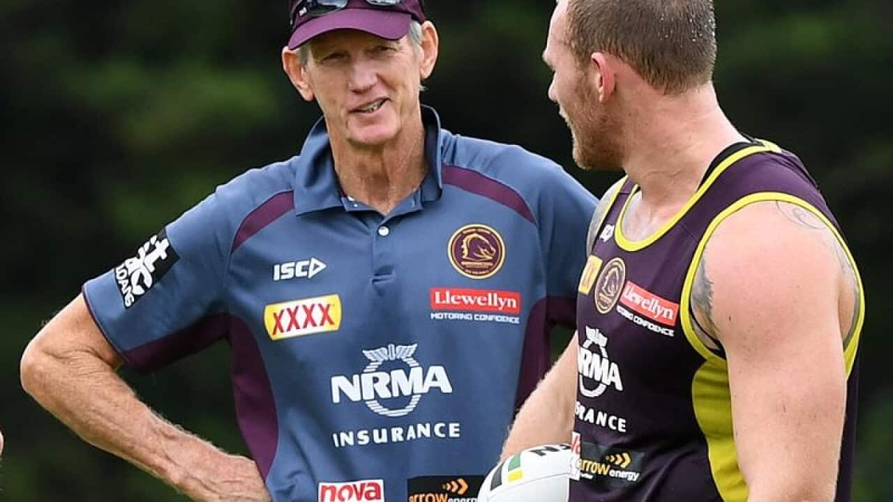 Coach Wayne Bennett looks on to Matt Lodge.