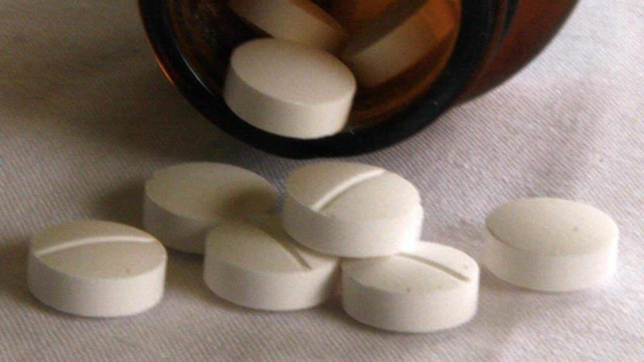 Tablets fall from a jar