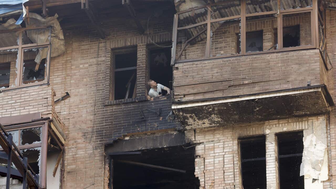 A man in a burnt out building in Kyiv