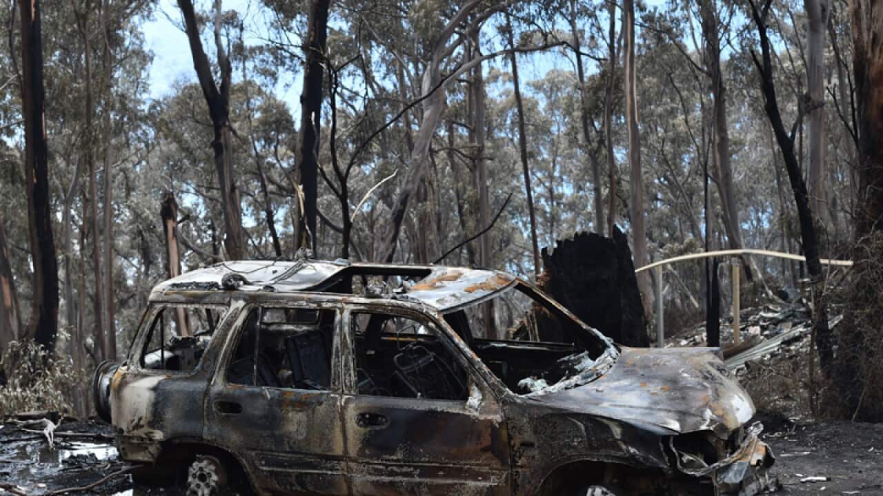 A fire damaged car is seen at Wye River