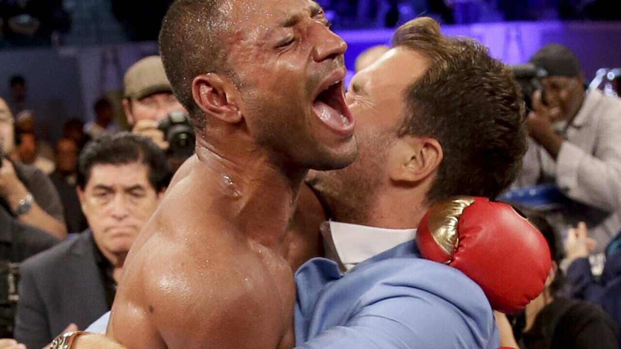 Kell Brook, left, celebrates his win against Shawn Porter