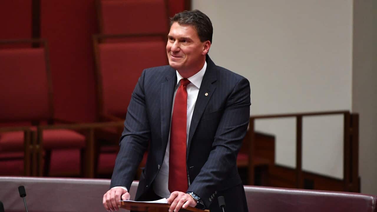 Independent Senator Cory Bernardi looks at his family as he delivers his valedictory speech in the Senate