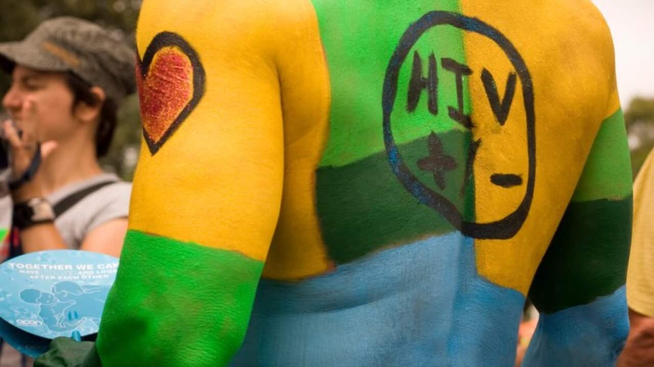 An activist raises awareness about HIV